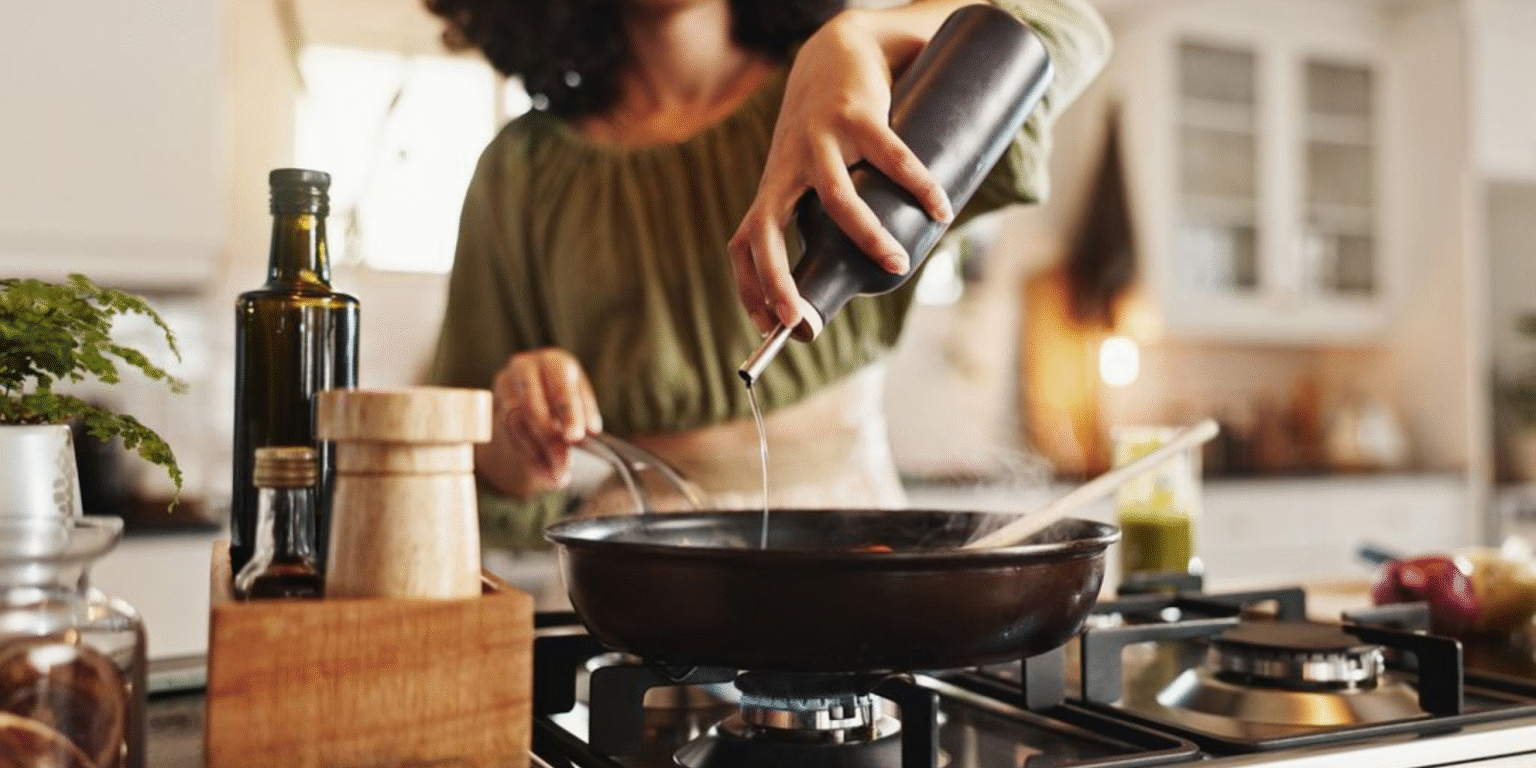 The Stress-Free Dinner System Busy Families Need a woman cooking, reflecting Simply Stocked’s mission to simplify mealtime for busy families with ease.