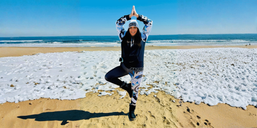 From Service to Serenity: Kimberly Vega’s Path to Healing and Empowerment with Zenith Soul "Kimberly Vega, Army veteran and founder of Zenith Soul, demonstrates yoga on the beach, promoting mind-body-spirit healing and empowerment."