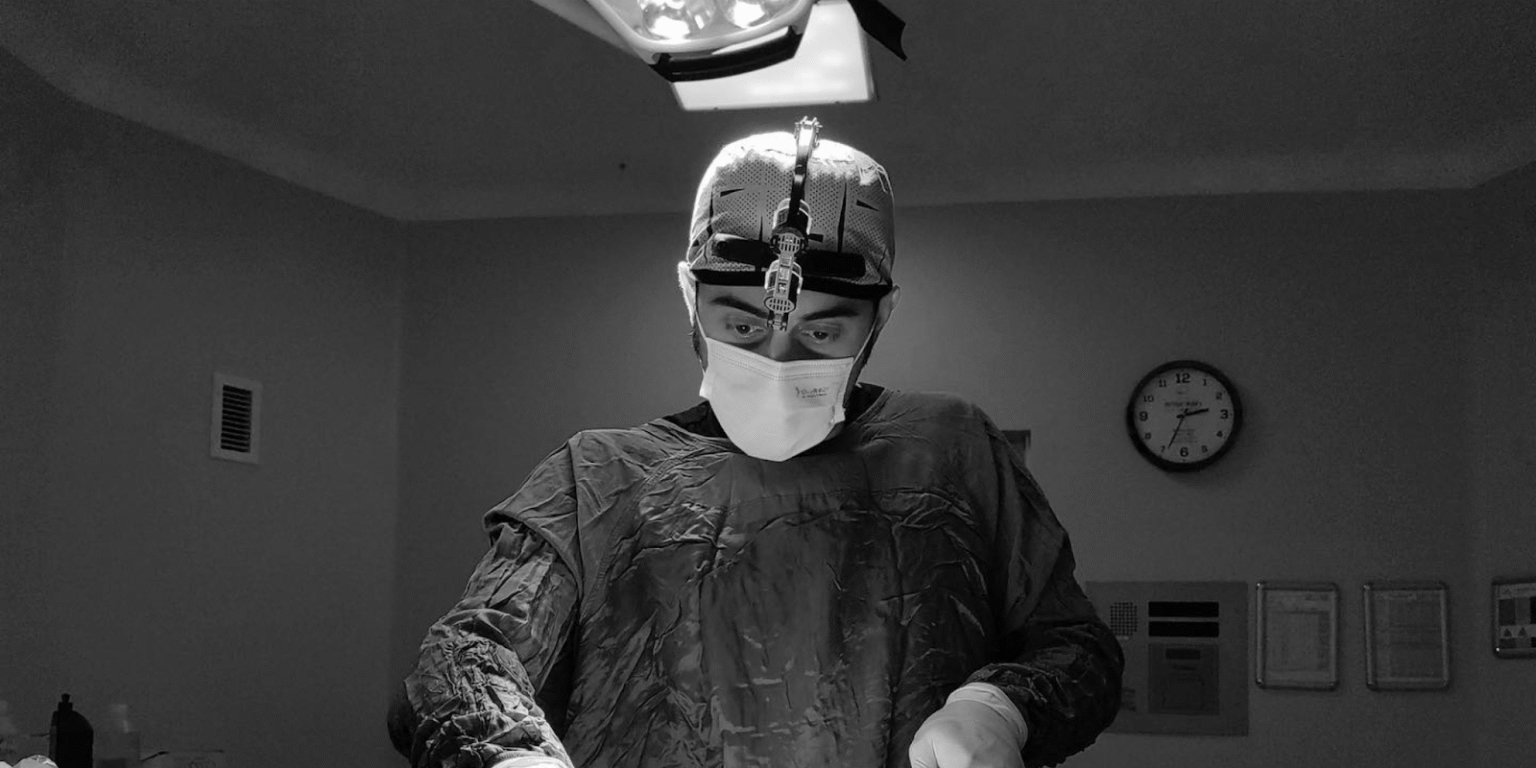 "Dr. Mehmet Fatih Okyay performing gender-affirming surgery with precision, offering compassionate care and expertise in facial feminization surgery."