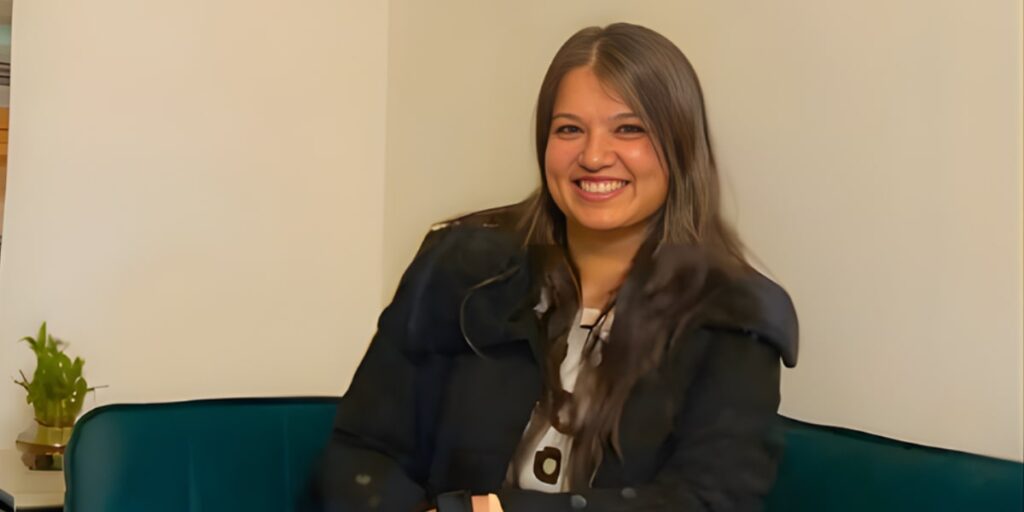 Deepanshi Gupta, Co-Founder of Dee&Cee Labs, smiling while seated, representing her AI-driven business automation solutions."