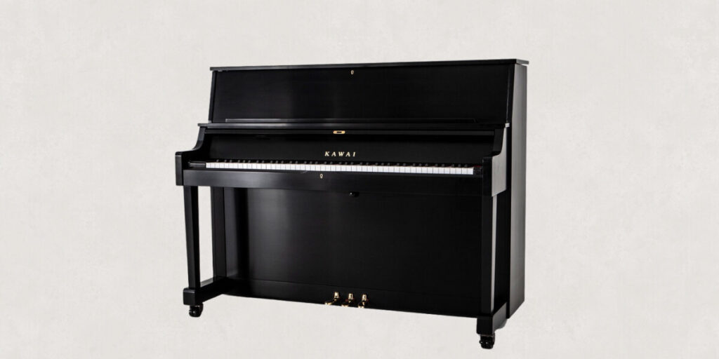 The Room Affects Your Piano More Than the Piano Affects Itself Black upright Kawai piano, highlighting the importance of room acoustics in enhancing sound quality, as discussed by Worldwide Piano.