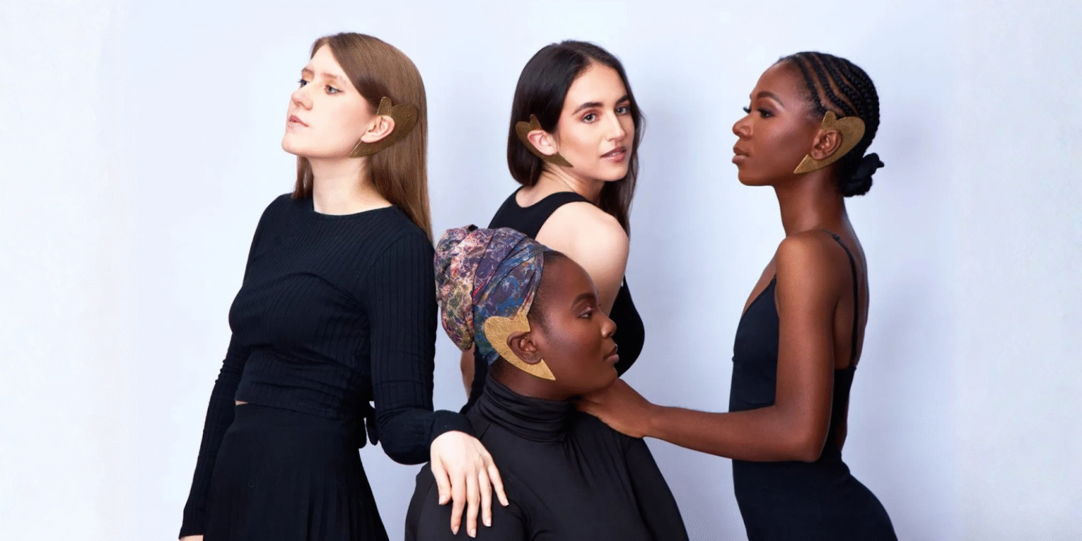 "Four models wearing bold, handmade African jewelry by Quemsa Afrique, showcasing cultural heritage and global fashion fusion."