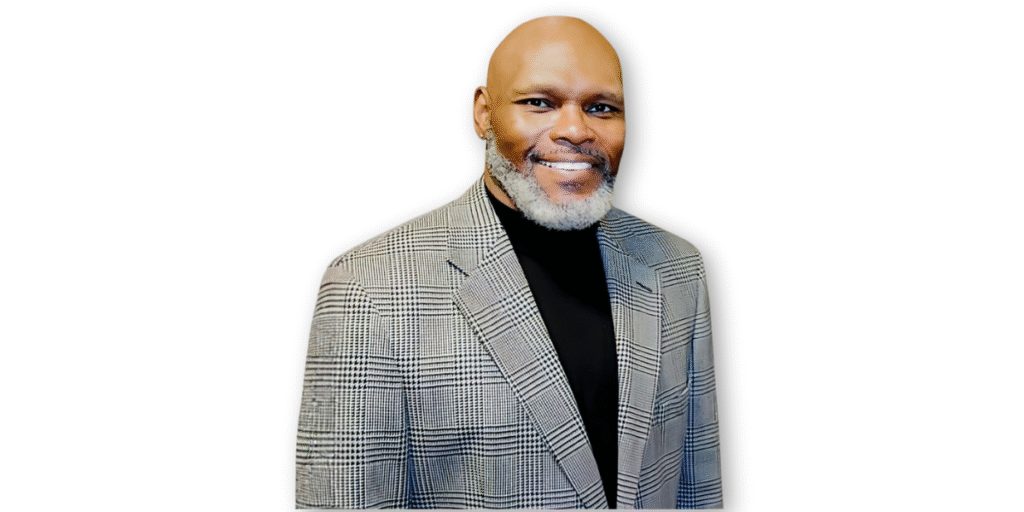 Dr. Michael Anthony Ingram, poet and educator, standing confidently in a professional suit, representing his work with the Poetic Empathy Cards