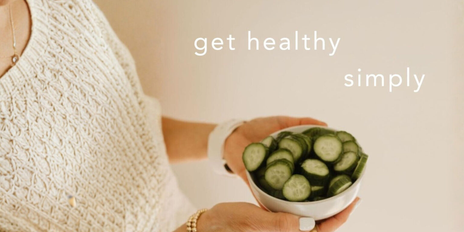 A woman holding a bowl of sliced cucumbers, representing healthy, simple eating habits supported by the simply app.