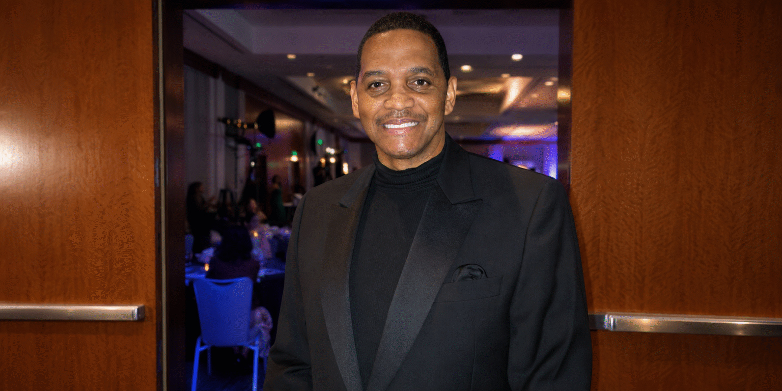 Prof. Robert Stewart Explores Paranormal Science and Spiritual Consciousness Prof. Robert Stewart smiles at a formal evening event in a black tuxedo and turtleneck.”