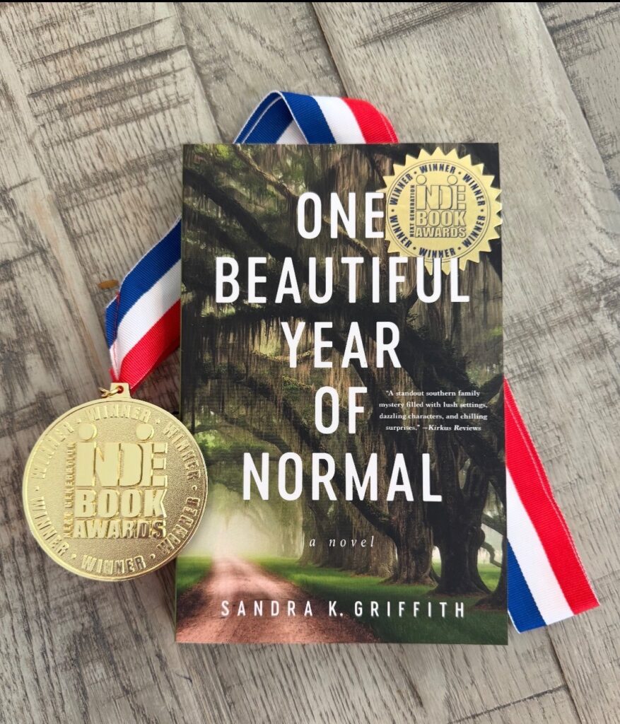 One Beautiful Year Of Normal novel with Next Generation Indie Book Awards medal and winner seal.